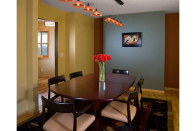 Inspiration for a contemporary light wood floor dining room remodel in Minneapolis with multicolored walls