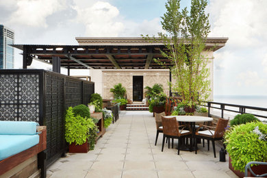 Large minimalist rooftop rooftop metal railing deck container garden photo in Chicago with a pergola