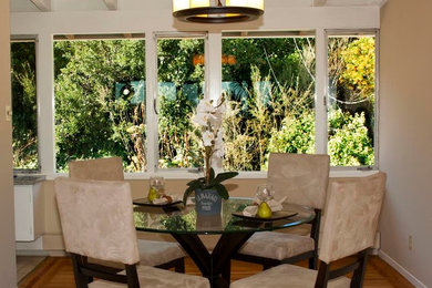 Great room - small contemporary light wood floor great room idea in San Francisco with beige walls and no fireplace