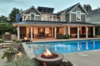 Huge elegant gray two-story wood exterior home photo in Denver with a hip roof
