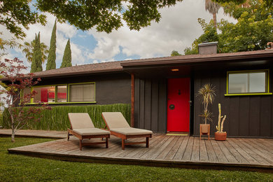 Example of a 1950s black house exterior design in Los Angeles