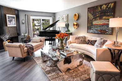 Mid-sized transitional formal and open concept light wood floor living room photo in Los Angeles with gray walls, a standard fireplace, a metal fireplace and no tv