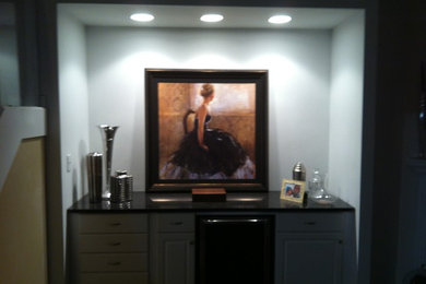 Inspiration for a small contemporary dark wood floor enclosed dining room remodel in Indianapolis with white walls and no fireplace