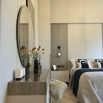 Tall Cabinetry Pale Stone Master Bedroom