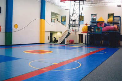 Photo of a mid-sized traditional indoor sport court in Boston with beige walls.