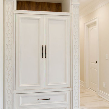 Traditional white entry mudroom.