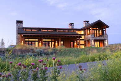 Large contemporary brown two-story wood gable roof idea in Salt Lake City