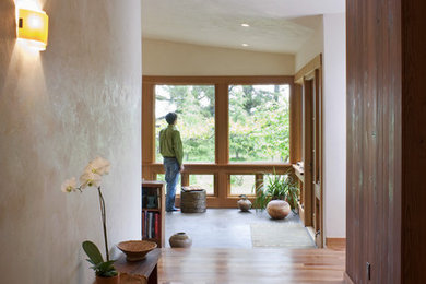 Eclectic entry hall photo in San Francisco with beige walls