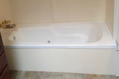 Inspiration for a ceramic tile bathroom remodel in Houston with dark wood cabinets