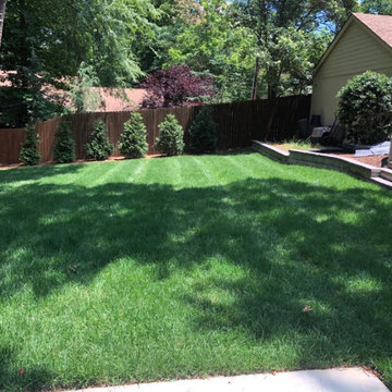 Screen porch, basketball court, and landscaping