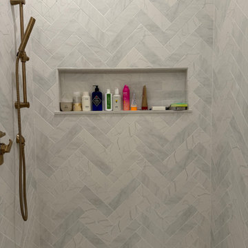 Custom Bathroom Renovation with Marble Herringbone Shower and Glass Enclosure