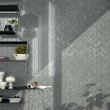 Modern grey living room with grey stone look flooring and walls
