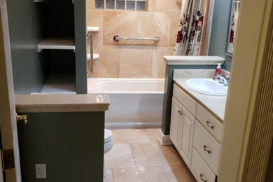 Inspiration for a mid-sized timeless brown tile and ceramic tile cement tile floor bathroom remodel in New Orleans