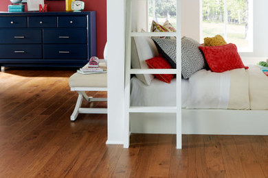 Kids' room - farmhouse medium tone wood floor and brown floor kids' room idea in Raleigh with red walls