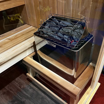 Sauna heaters installed with correct clearances and guarding