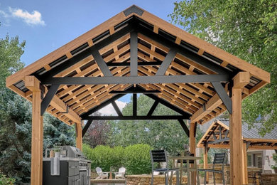 Example of a trendy backyard patio kitchen design in Austin