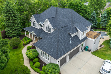 Inspiration for a craftsman gray two-story house exterior remodel in Indianapolis with a hip roof, a shingle roof and a black roof