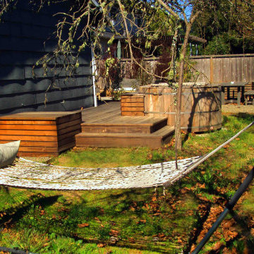 Hidden hammock nook with raised planter and expanded deck