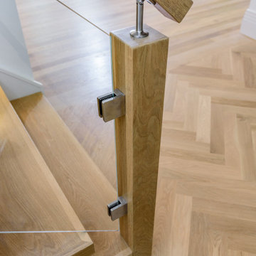 Custom White Oak Staircase with Starfire Tempered Glass Panels