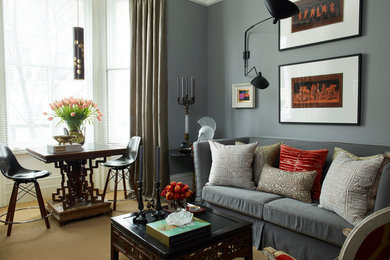 This is an example of an eclectic formal living room in London with grey walls, carpet and brown floor.