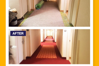 Example of a large carpeted hallway design in Charlotte