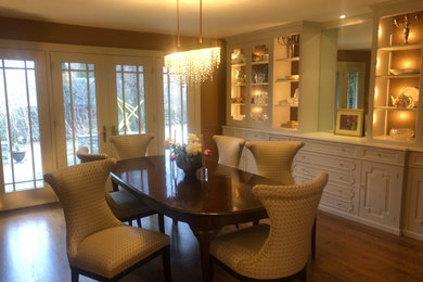 Photo of a mid-sized transitional dining room in Philadelphia with dark hardwood floors.