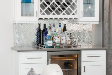 Inspiration for a contemporary home bar remodel in Other