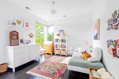 Inspiration for a contemporary girl dark wood floor and brown floor teen room remodel in Denver with white walls