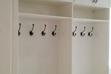 Mudroom - mid-sized transitional mudroom idea in Toronto with white walls