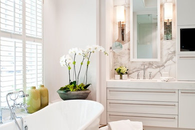 Example of a mid-sized trendy freestanding bathtub design in Toronto with flat-panel cabinets, white walls and an undermount sink