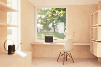 This is an example of a small contemporary home studio in Other with white walls, concrete flooring, a built-in desk, grey floors and panelled walls.