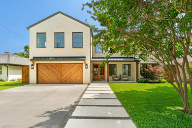 Inspiration for a transitional beige two-story brick exterior home remodel in Dallas with a metal roof and a gray roof