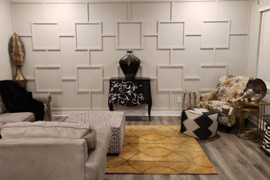 Example of a large classic wall paneling family room design in Other