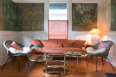 Family room - small farmhouse enclosed medium tone wood floor family room idea in Portland with multicolored walls, no fireplace and no tv