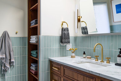 Example of a mid-sized transitional master blue tile and subway tile white floor and single-sink bathroom design in DC Metro with brown cabinets, white countertops and a built-in vanity