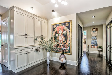 Example of a minimalist dark wood floor entryway design in New York with beige walls