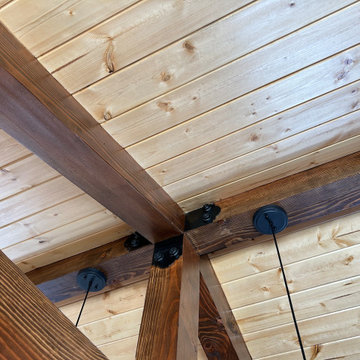 Wood vaulted ceiling with exposed beams/timber trusses
