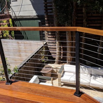 Split Level Travertine Patio and Ipe Deck with Cable Railing