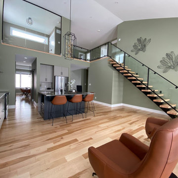 Open Concept Living Room and Kitchen with a view of the Second Floor