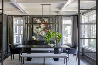 Example of a mid-sized transitional dark wood floor, brown floor, coffered ceiling and wallpaper enclosed dining room design in Boston with gray walls and no fireplace