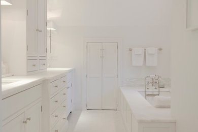 Large minimalist master white tile and stone tile marble floor doorless shower photo in Boston with flat-panel cabinets, white cabinets, an undermount tub, a one-piece toilet, white walls, an undermount sink and quartzite countertops