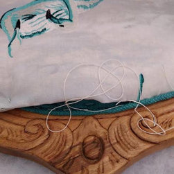 Hand sewing of the fabric to the piping. - Building Materials