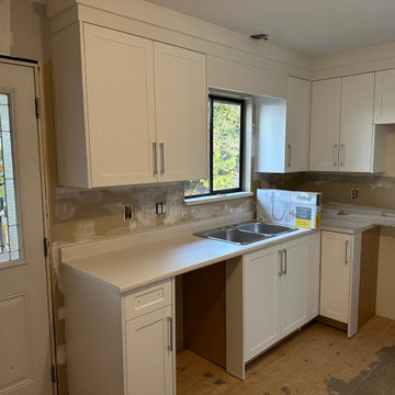 Tiny kitchen storage maximized with our all white custom cabinets