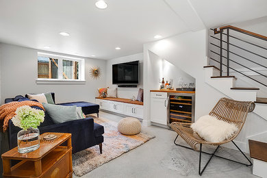 Inspiration for a transitional look-out basement remodel in Seattle with white walls