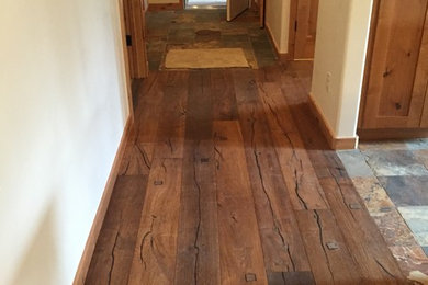 Hallway - scandinavian medium tone wood floor and brown floor hallway idea in Denver