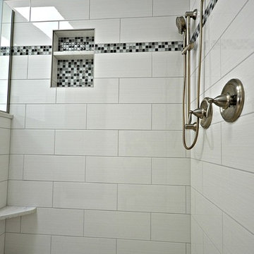 Updated tile with glass accents and glass tile niche.