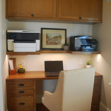 Custom built shelves hold two large printers