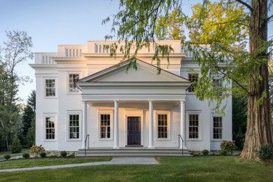 Example of a classic two-story exterior home design in Other