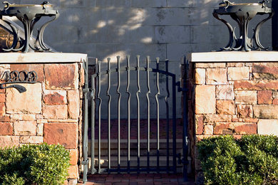 This is an example of a mid-sized victorian shade courtyard brick retaining wall landscape in Kansas City for spring.