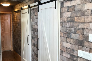Kitchen pantry - large country u-shaped medium tone wood floor and brown floor kitchen pantry idea in Minneapolis with white cabinets, granite countertops, multicolored backsplash, porcelain backsplash, stainless steel appliances and brown countertops